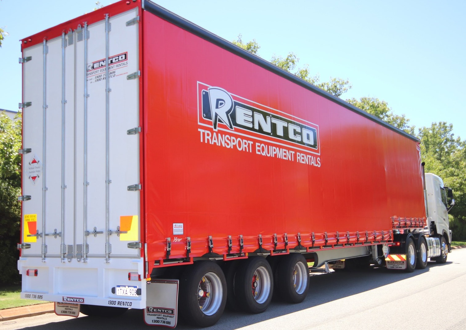 A tautliner truck with 'Rentco Transport Equipment Rentals' written on the side